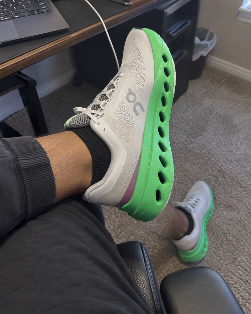 Home-office try-on of On Cloudsurfer Next in Wolf and Honeydew